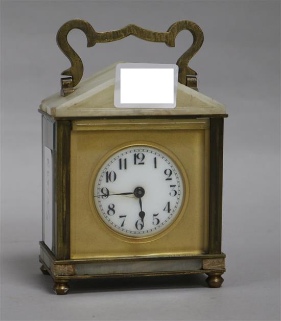 A brass and white onyx carriage timepiece
